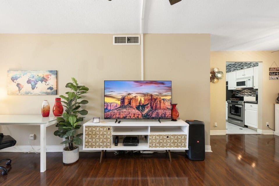 The spacious living room includes a smart TV for your entertainment.