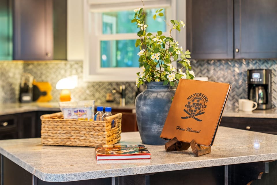 Stylish kitchen island with welcome touches, coffee station, and modern finishes