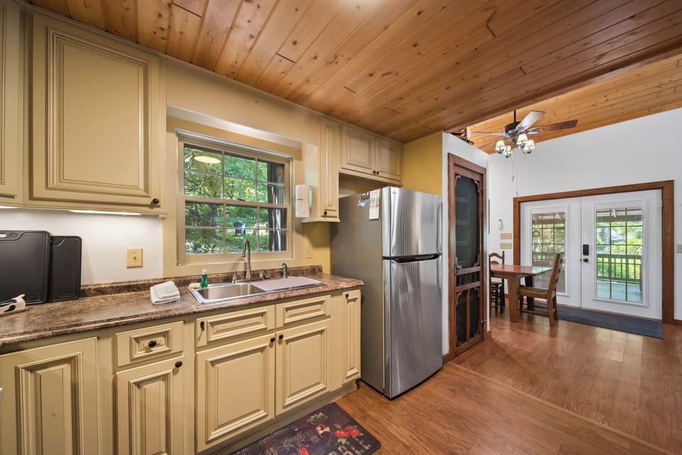 Bright kitchen with stainless steel appliances and easy access to the dining area