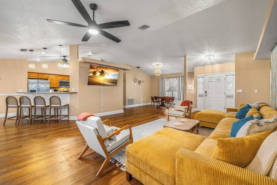 Open-concept layout connects the living room, kitchen, and dining area.