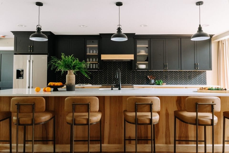 Gather around the expansive kitchen island—made for morning coffee, casual bites, and time together.