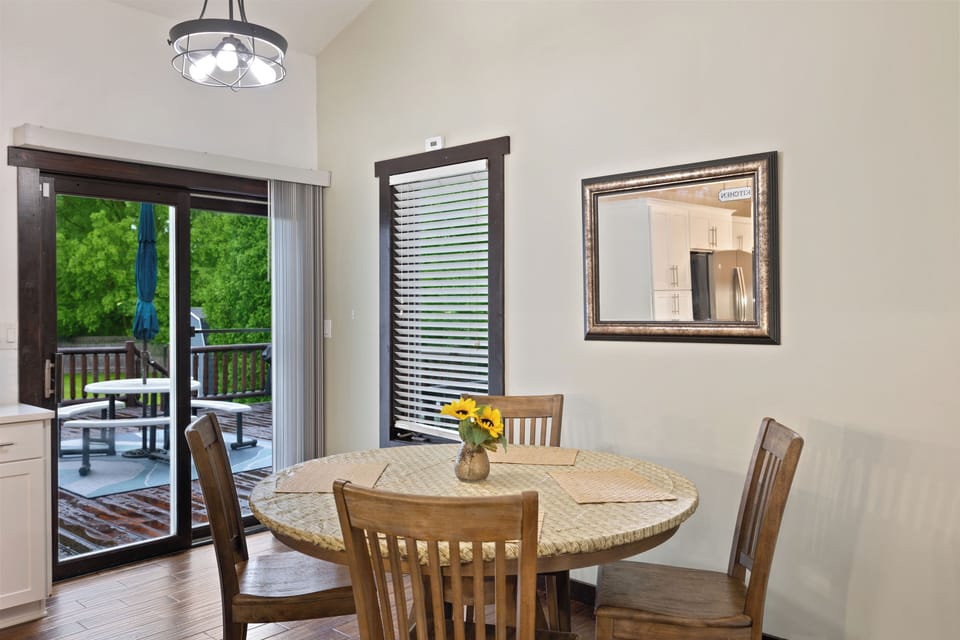 Dining room table with view onto the deck. 