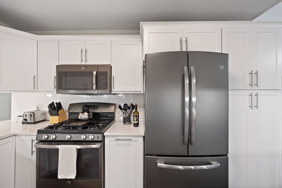 Fully equipped kitchen with modern appliances.