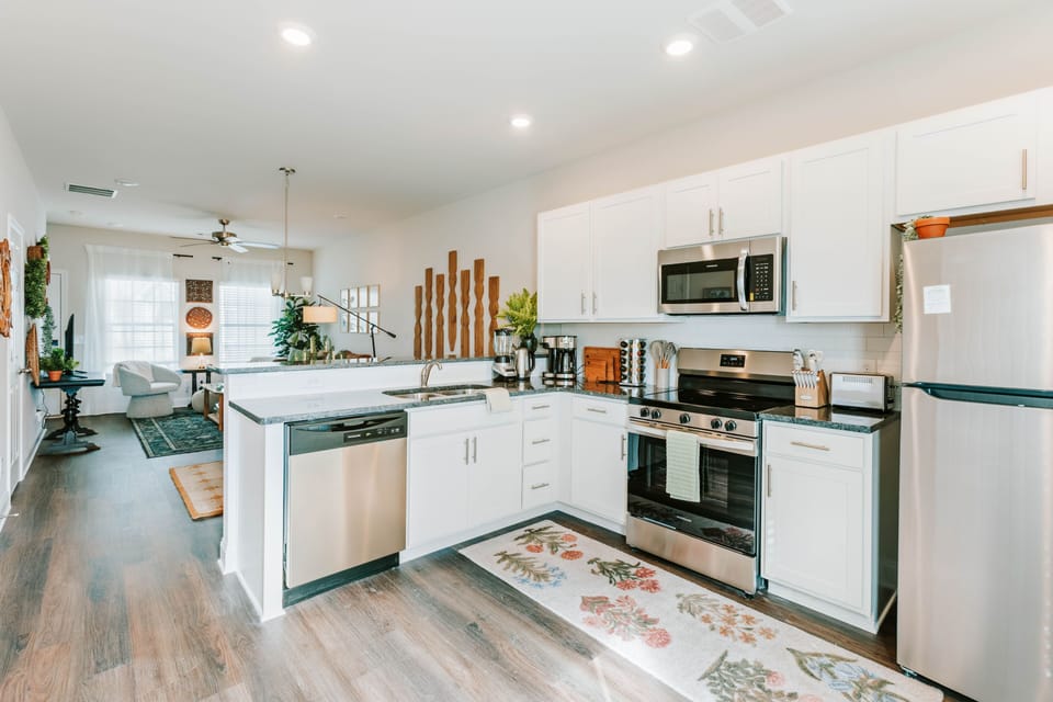 Cook with ease in a bright kitchen with stainless appliances.