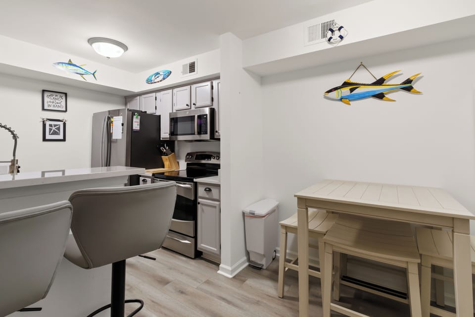 Open-concept kitchen with breakfast bar seating for 2