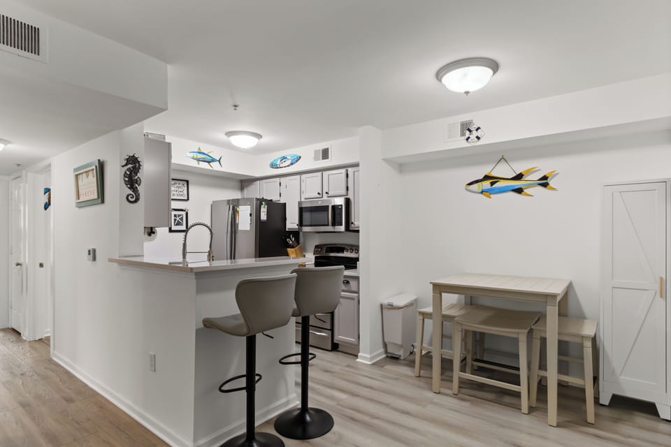 Bright, functional kitchen flows right into the dining nook