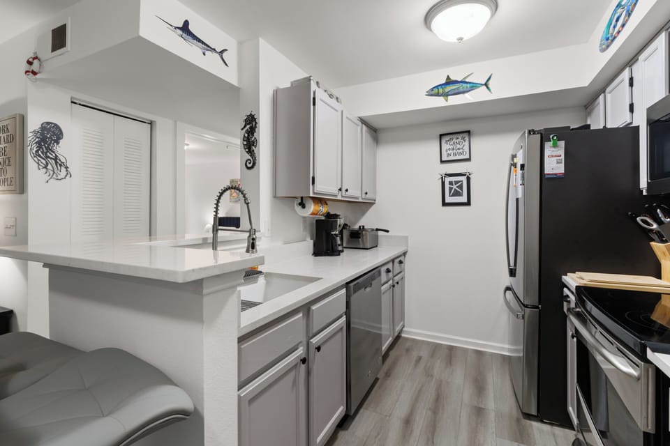 Coastal-themed kitchen with playful fish accents throughout