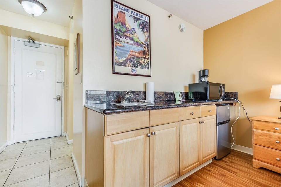 Your cozy kitchenette awaits, complete with a microwave, coffee maker, and mini-fridge—perfect for quick meals or morning coffee before exploring the island paradise just outside your door.