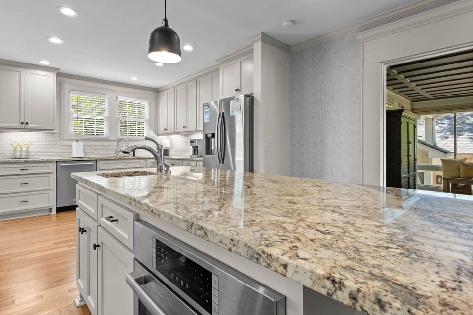 Gourmet Kitchen with Two Ovens & Large Granite Island