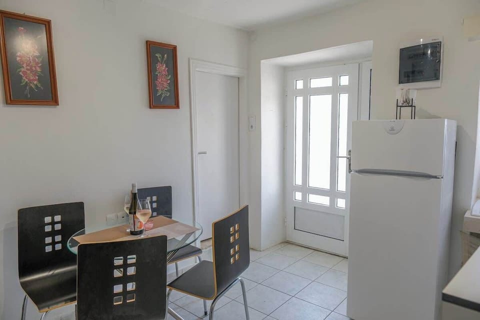 Fully equipped kitchen and dining area with rustic charm.
