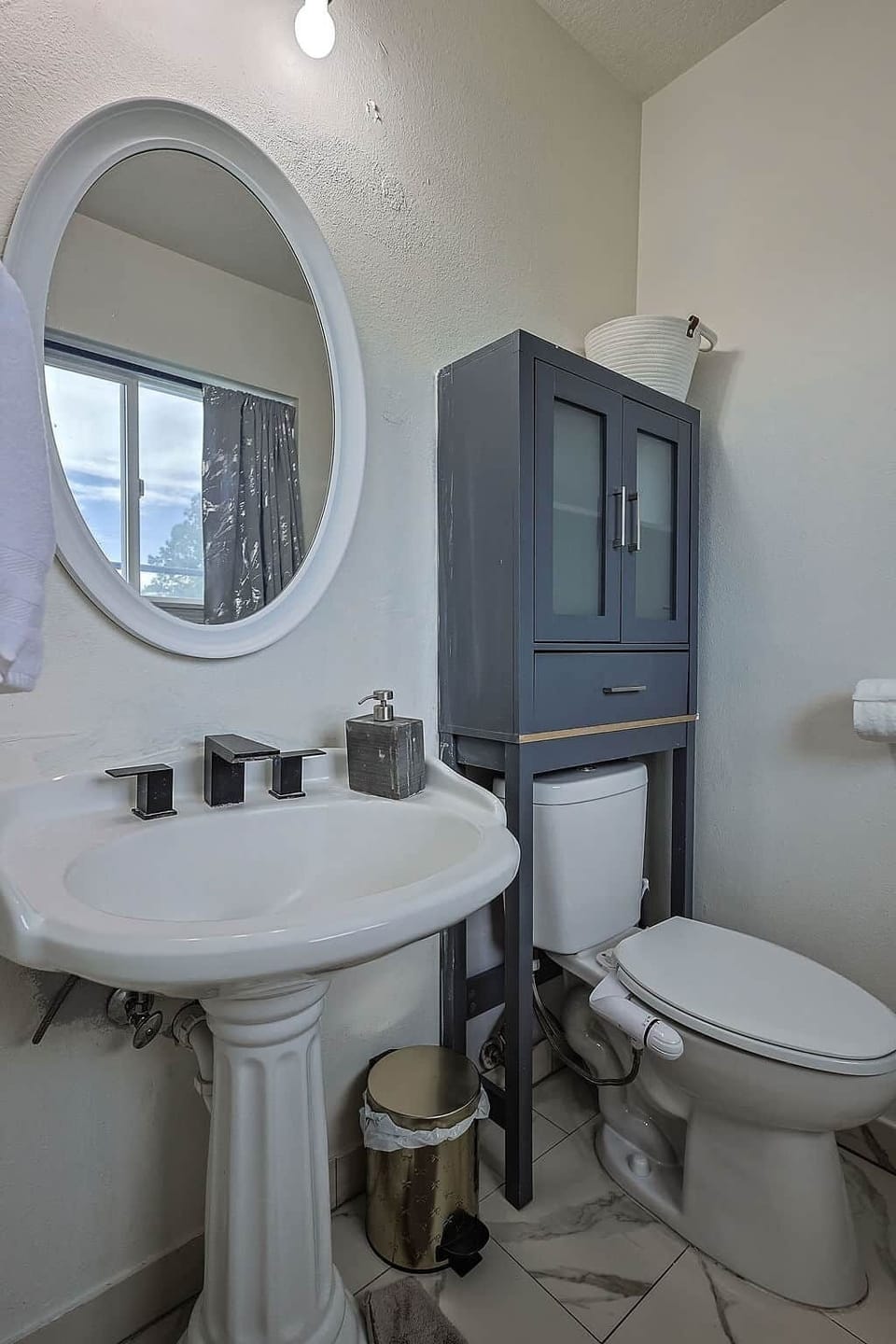 Stand‑up shower bathroom with fresh towels, soap, and hair dryer