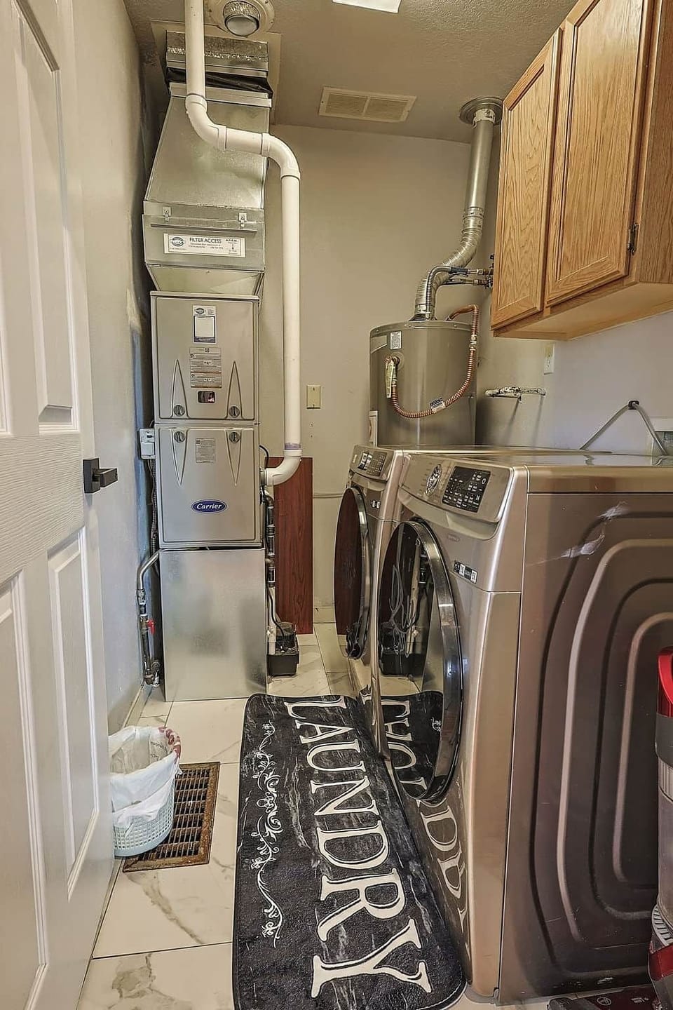 Laundry room with modern washer and dryer so you can pack light and stay fresh