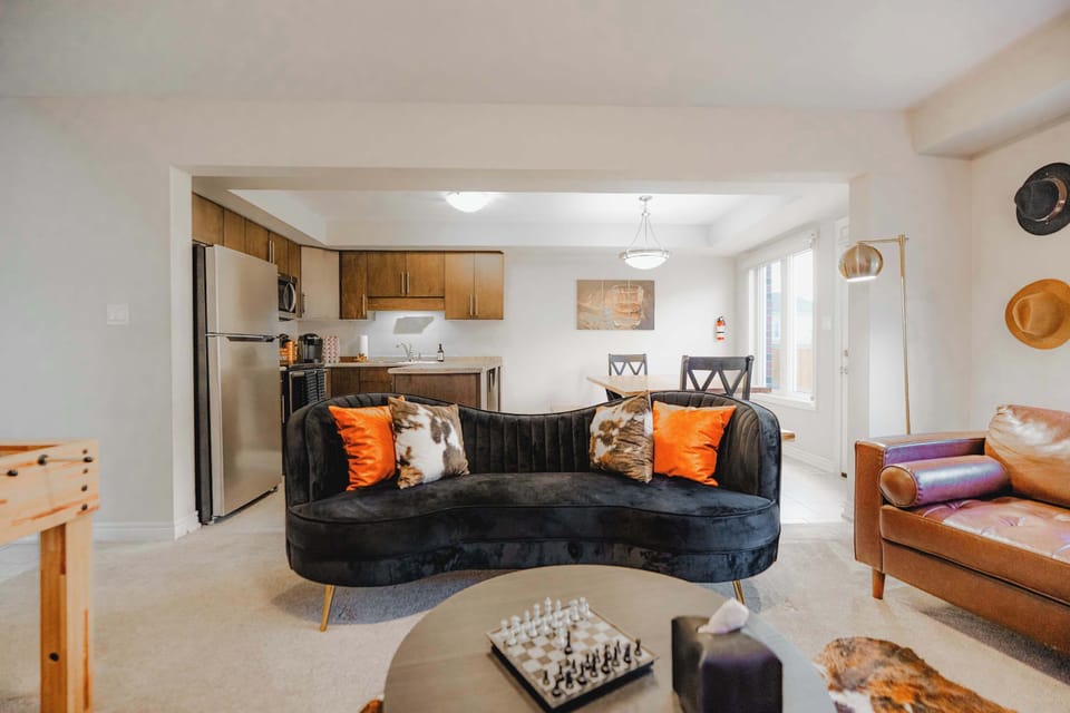 The open layout connects the living room and kitchen, creating a welcoming space for families, groups, and social gatherings.