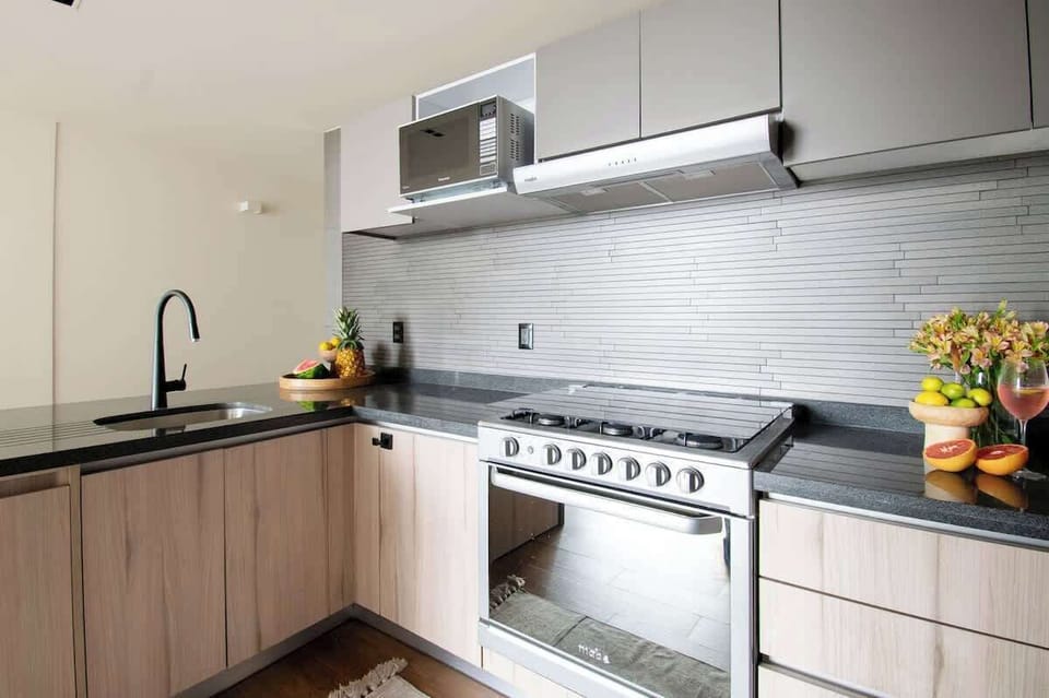 Featuring a full-size stove, oven, microwave, and premium appliances, this kitchen is ready for both short getaways and extended stays.