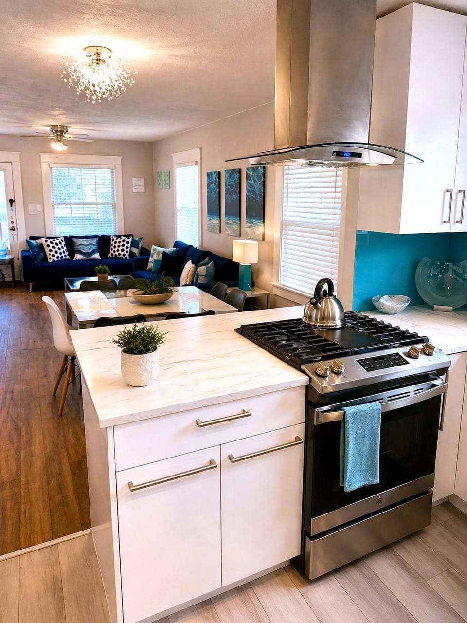 Bright open kitchen with gas range and stylish lounge seating