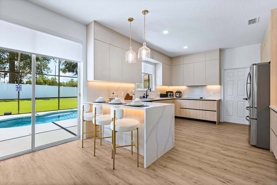 The heart of the home. A gorgeous kitchen island with instant access to your private pool oasis