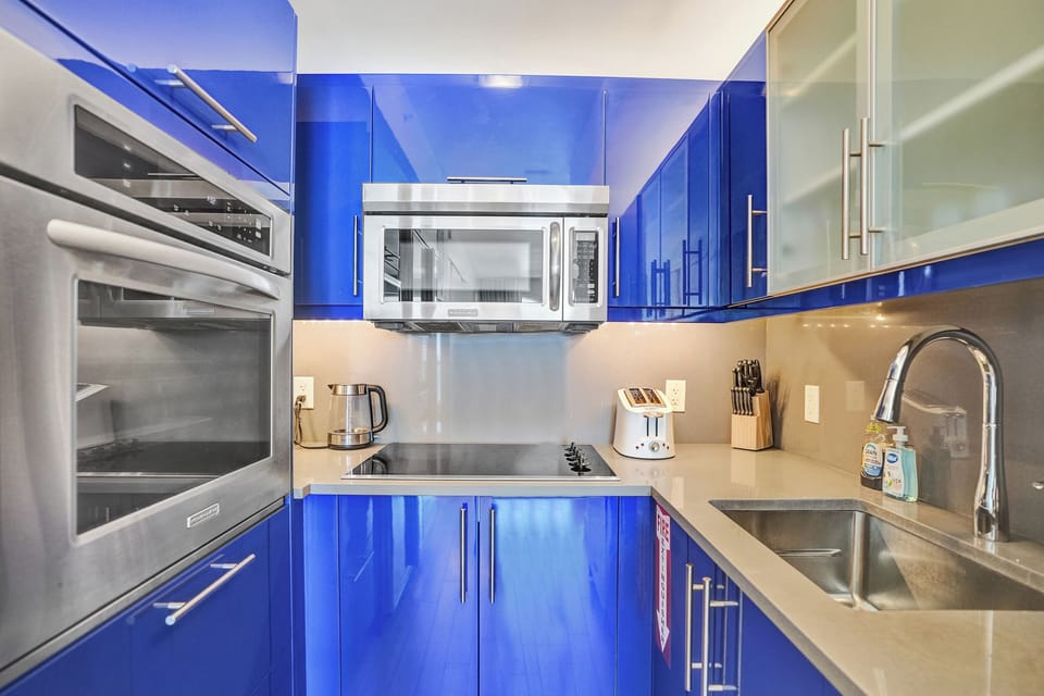 Sleek, fully equipped kitchen with modern appliances ready for easy home-cooked meals