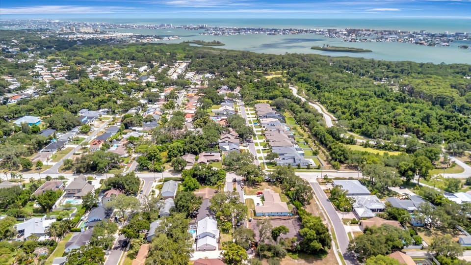 Aerial view highlighting the home's location near beaches, parks, and waterways.