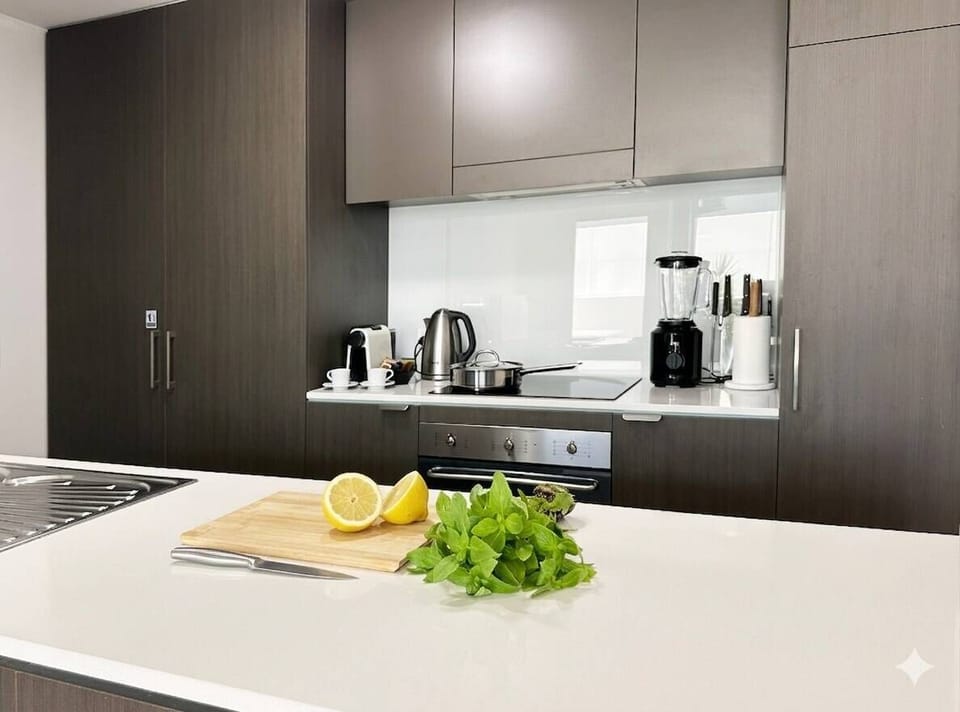 Full kitchen with ceramic cooktop, oven, and kitchen island