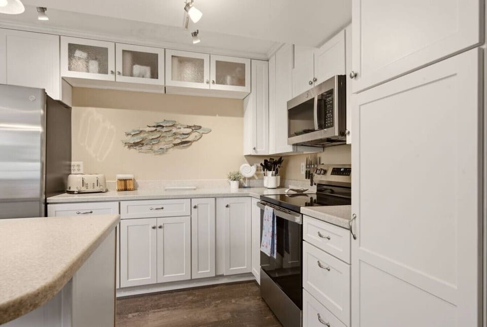 Cabinets are stocked with all the dishes and serving wear you`ll need!