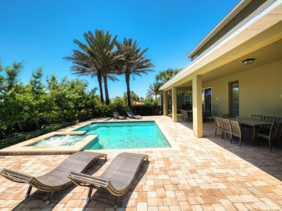 Elegant outdoor living space designed for relaxing poolside and enjoying the Florida sunshine.