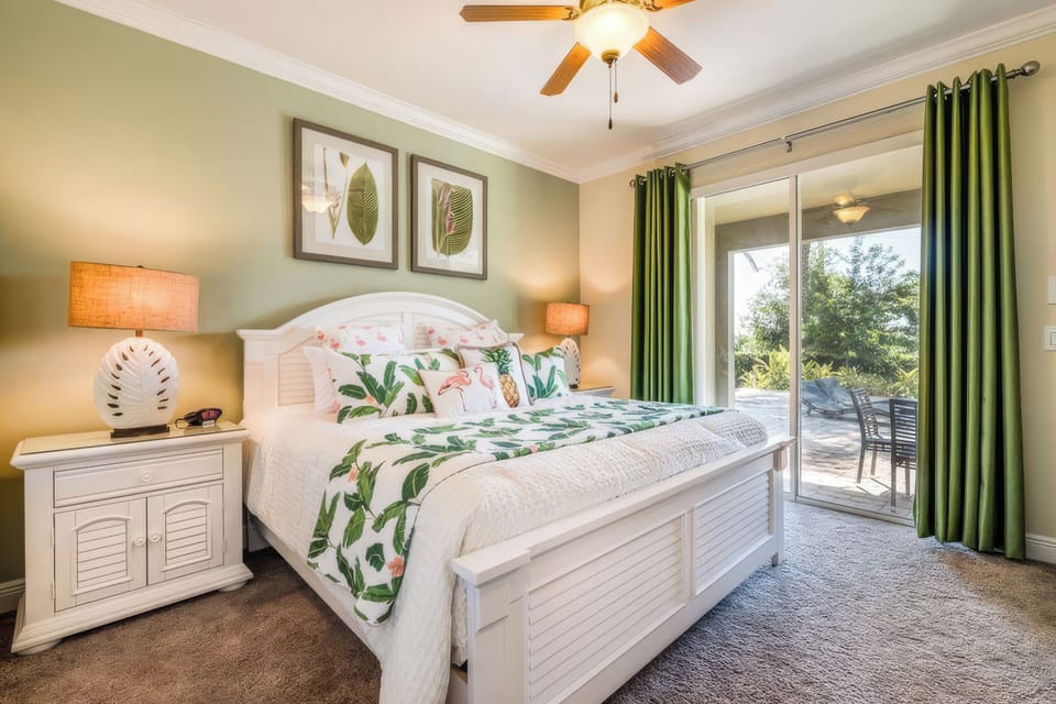 Coastal-inspired bedroom with direct access to the outdoor living area.