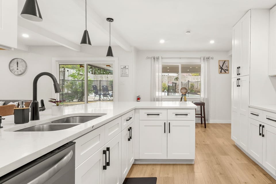 Bright, open kitchen with patio views—perfect for cooking and connecting ✨
