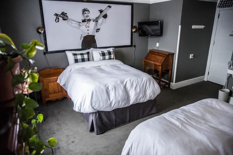 Drift off in a snug room with playful, artistic personality.