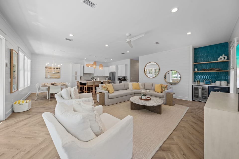 **Living Room** You can move effortlessly from breakfast at the dining table to coffee at the island and a movie on the sofa, all without losing sight of the group.