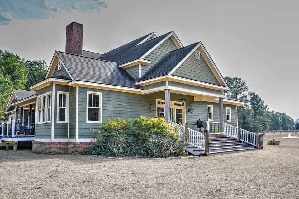 Charming Southern-style home with welcoming front porch and serene natural surroundings.