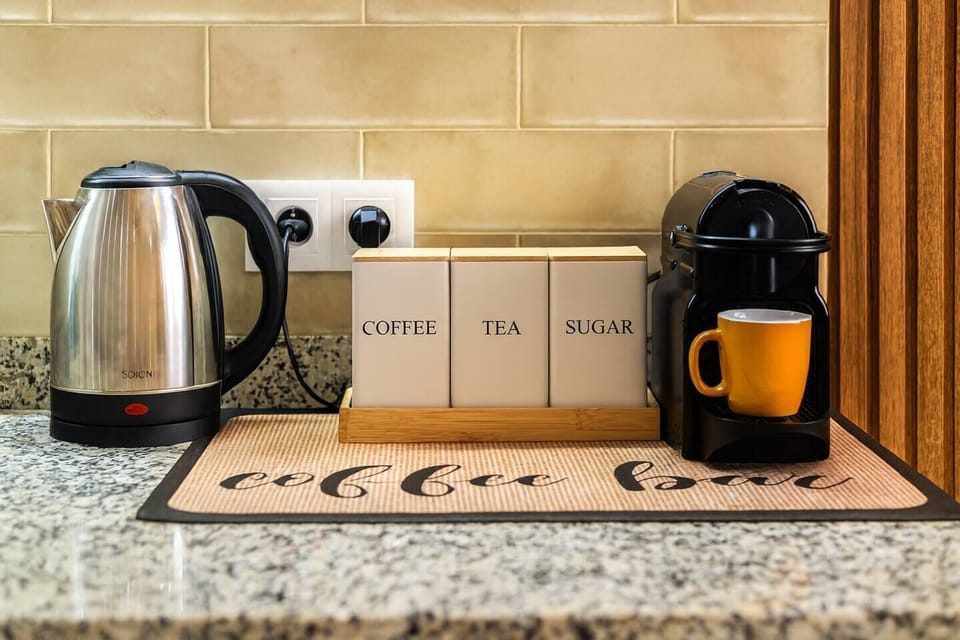 A cozy little coffee corner with everything stocked: coffee, tea, sugar, and fresh capsules. Plus a gift basket made with love, just for you.