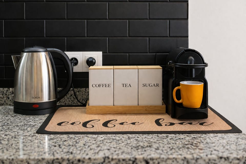 A cozy little coffee corner with everything stocked: coffee, tea, sugar, and fresh capsules. Plus a gift basket made with love, just for you.