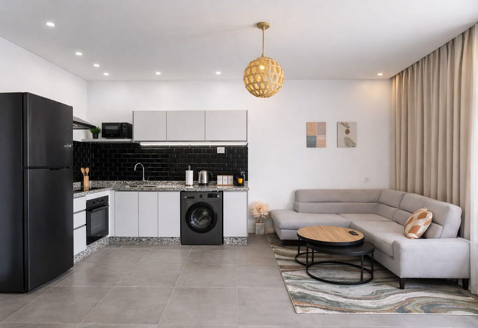 Modern open-plan kitchen and lounge with in-unit washer