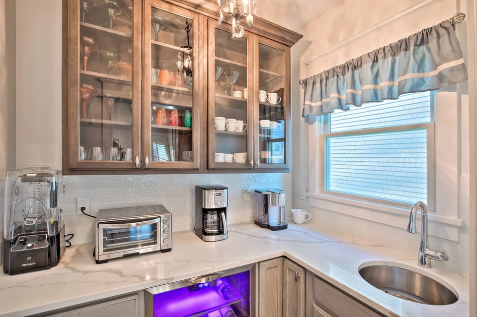 Butler's pantry with multiple coffee pots, industrial blender and toaster oven