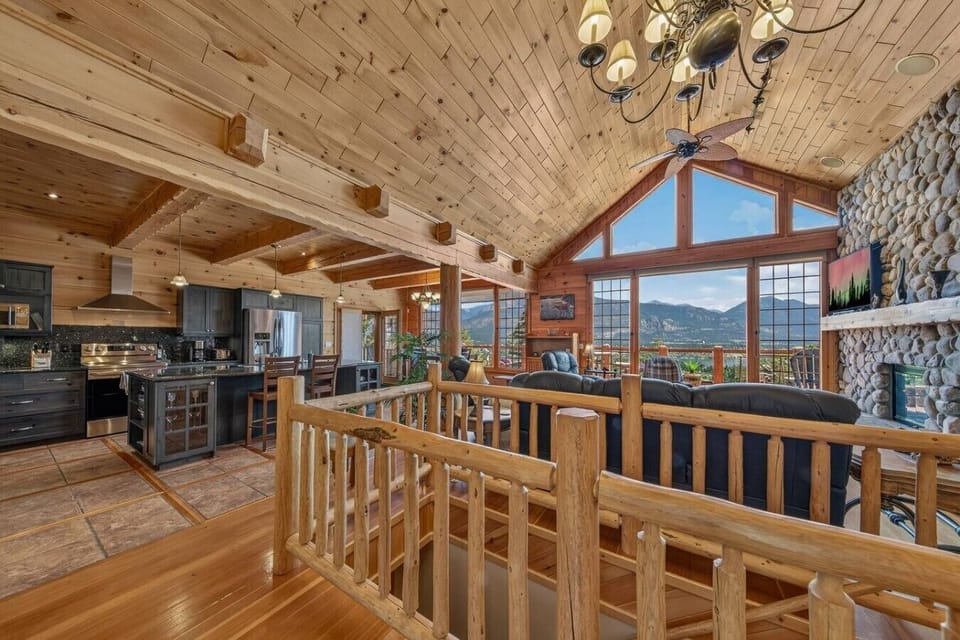 Relax in the living room while enjoying mountain and lake views through the windows.