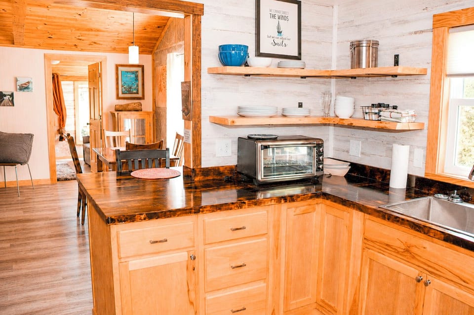 Kitchen with access to eat at peninsula and open to dining area