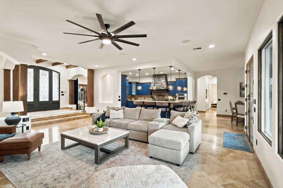 Bright open living space with designer kitchen and upscale architectural charm