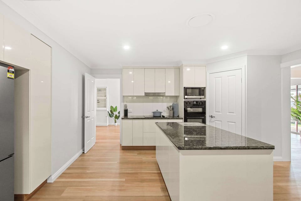 Fully equipped kitchen with quality appliances and generous bench space