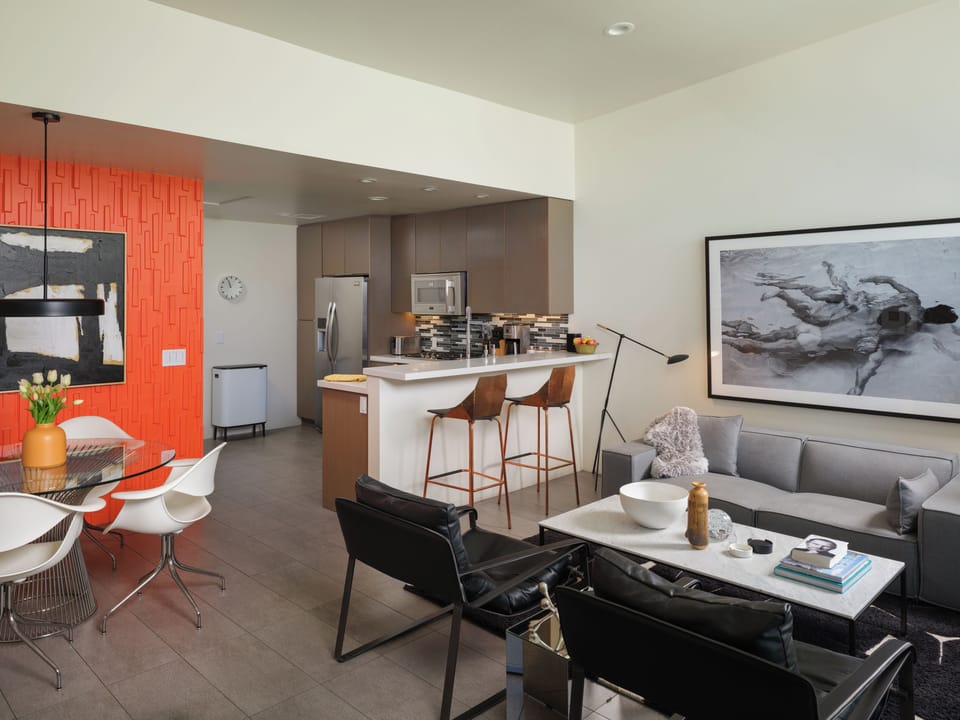 Open living space with modern kitchen and designer dining area