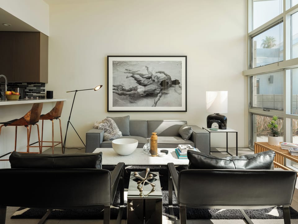 Bright living room with designer furnishings and soaring ceilings