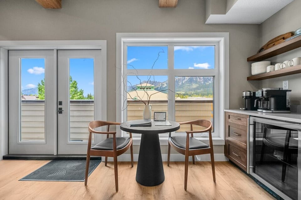 Enjoy morning coffee by the windows with mountain views outside.