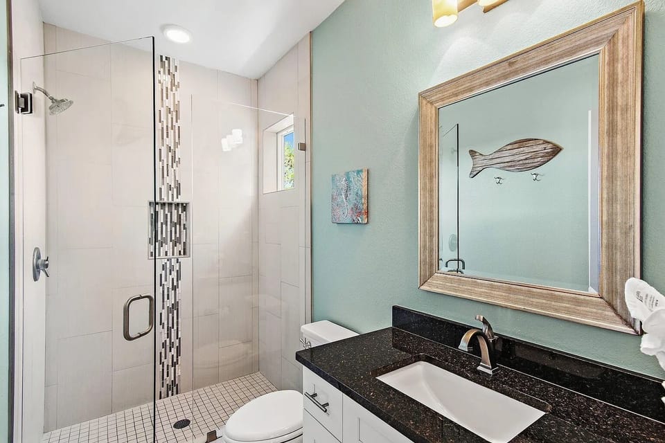 Private ensuite bathroom with a spacious vanity and walk-in shower for added comfort and convenience.
