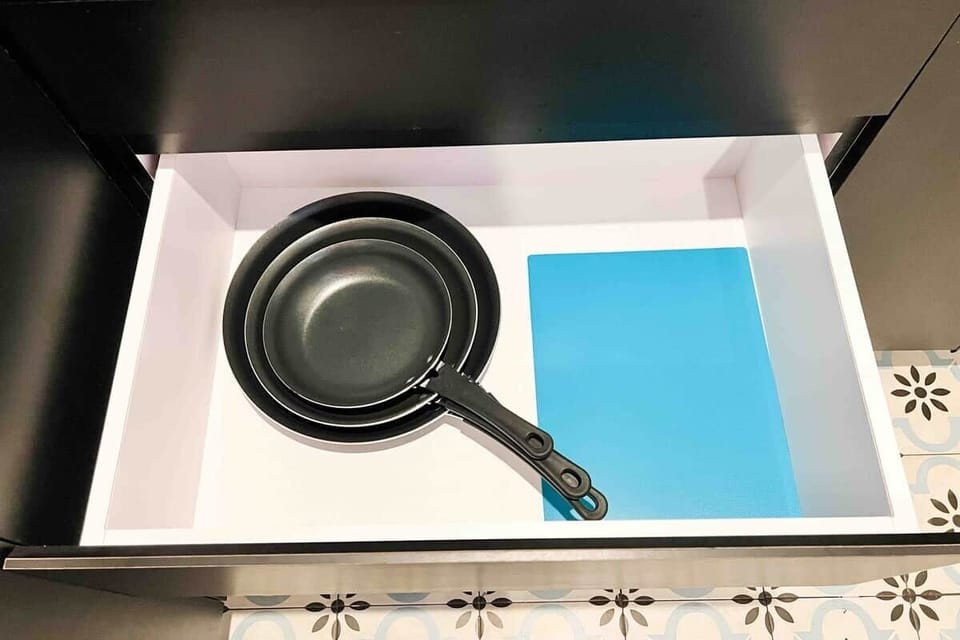 You'll find basic cooking tools like pans, pots, cutting boards, and more, all here for your convenience.