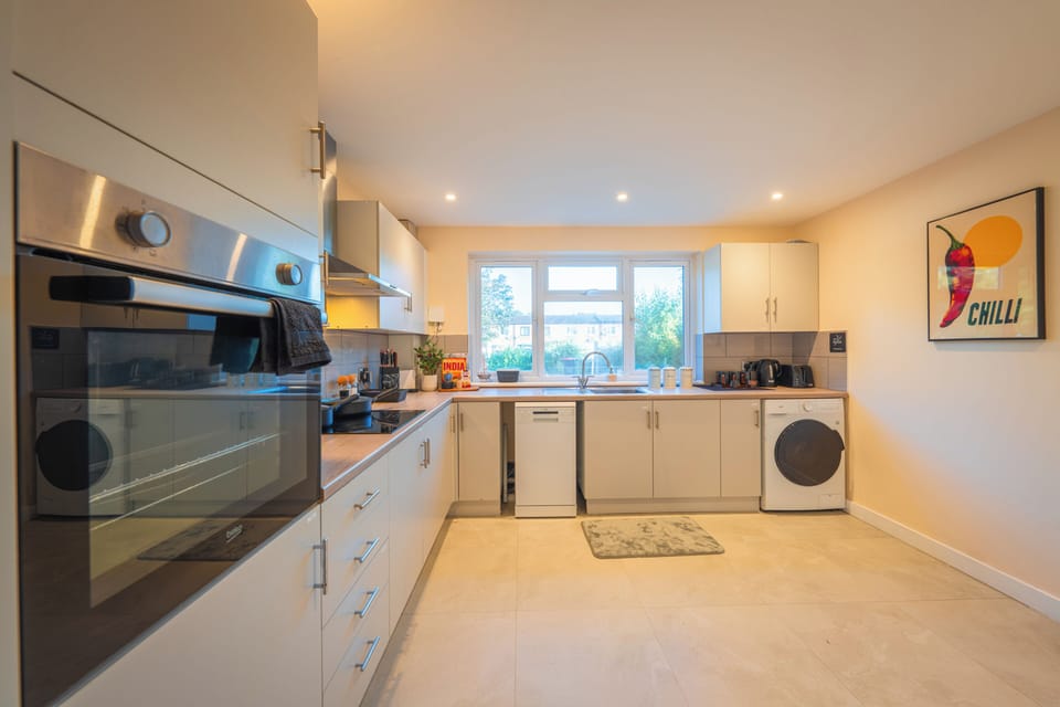 Bright modern kitchen with full appliances and plenty of natural light