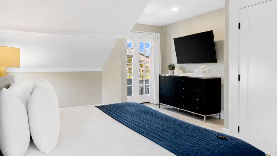 Primary suite king bed — sink in after a day at the San Diego Zoo, Coronado Beach, or Balboa Park.