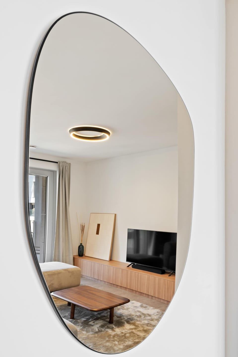 Elegant mirror detail that reflects the apartment’s bright, modern, and thoughtfully designed style.