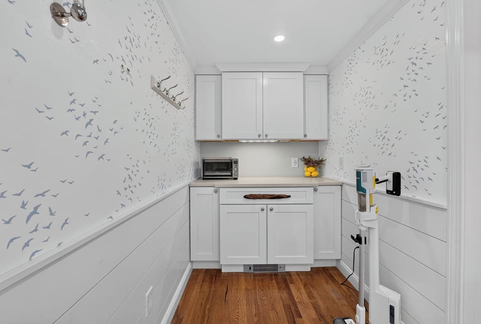 Convenient laundry room with modern appliances for extended stays.