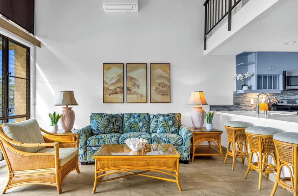 Unit 1: Cozy and bright living space is furnished for relaxation. The perfect spot to kick back, read a book, or just enjoy the peaceful atmosphere after a day out