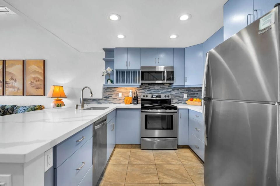 Unit 1: Cook with ease in a stylish kitchen equipped with stainless-steel appliances, sleek countertops, and ample storage for a clean, organized look.