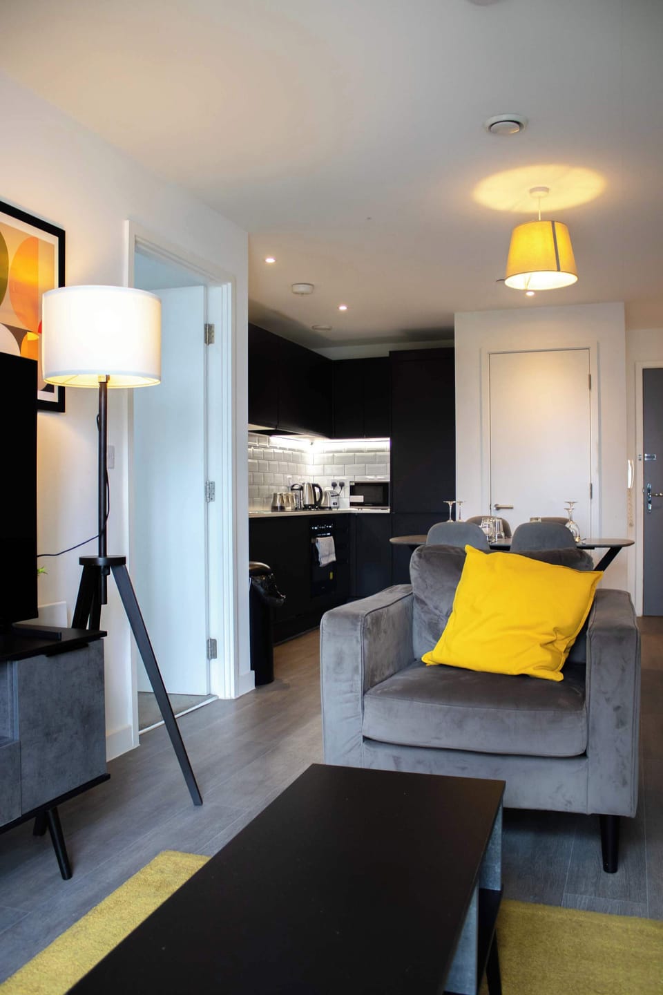 The bright open-plan living area brings together the lounge, kitchen, and dining space in one welcoming setting. Featuring comfortable sofa seating, a Smart TV, and a dining area, it's ideal for relaxing, working, or enjoying meals together.